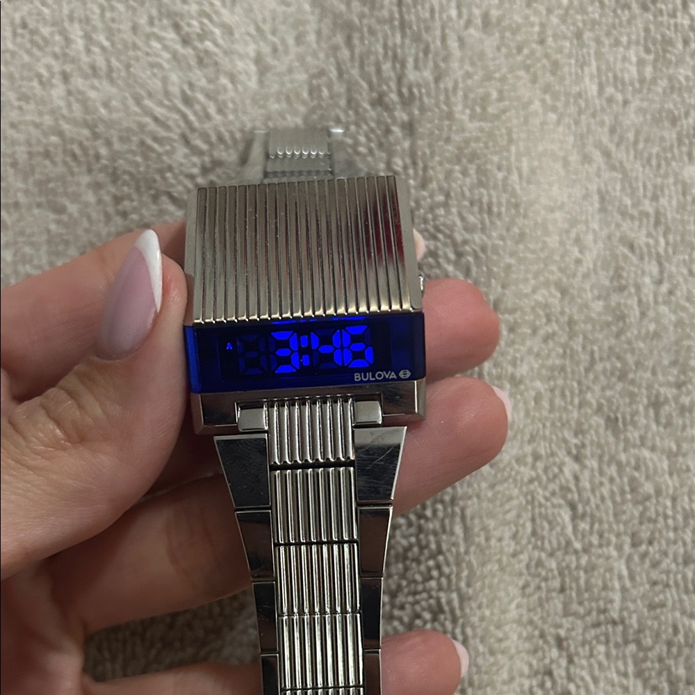 SOLD Bulova Silver Smartwatch with Vibrant Blue Screen